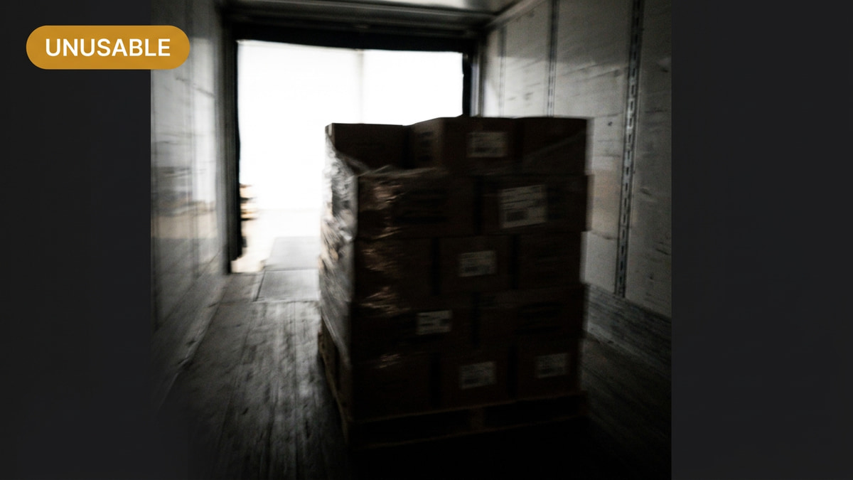 A blurred, underexposed dock photo flagged as unusable